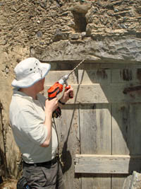Drilling a core sample from an old house in Crete.